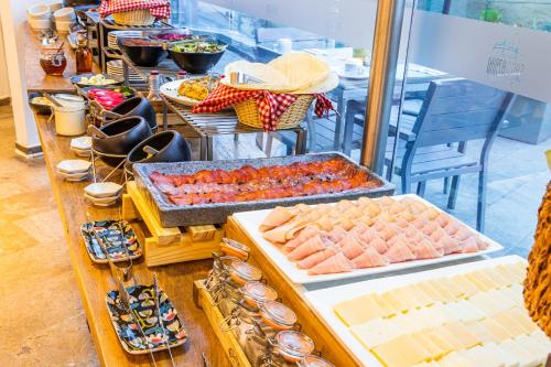 a buffet of food on display in a store at GHL San Lazaro Art Hotel in Cartagena de Indias