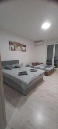 Ένα ή περισσότερα κρεβάτια σε δωμάτιο στο Apartment BeoSun