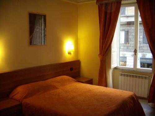 a bedroom with a bed and a window at Appartamento Privato Simone in Rome