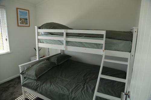 a couple of bunk beds in a room at 406 Sea View Road in Bridlington