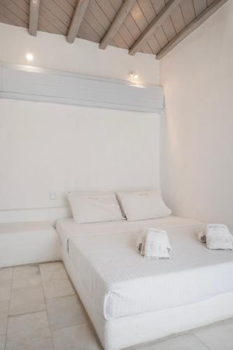 Ένα ή περισσότερα κρεβάτια σε δωμάτιο στο Nama Villas 