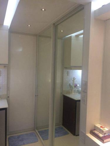 a bathroom with a walk in shower and a sink at Roxas Blvd Stunning Studio Condo Near US Embassy in Manila