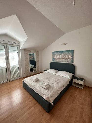Posteľ alebo postele v izbe v ubytovaní Apartments Villa Ohana