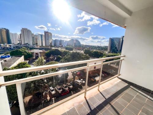 a balcony with a view of a city at Apart Hotel em Brasília - Garvey Park Hotel in Brasília