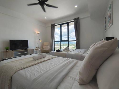 a bedroom with two beds and a large window at 【NEW】Modern Comfort Studio@Juru Sentral Icon City in Bukit Mertajam