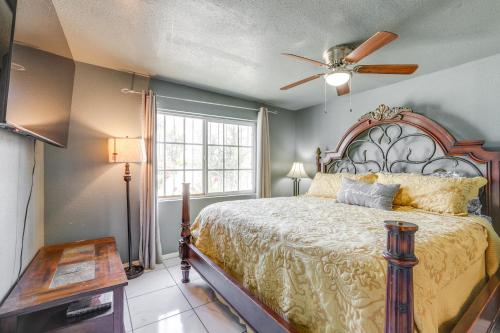 a bedroom with a large bed and a ceiling fan at Pet-Friendly Phoenix Vacation Rental Near Downtown in Phoenix
