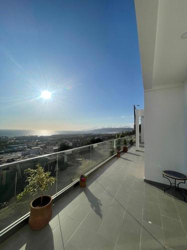 a balcony with a view of a city at Maison Lapierre d'agadir in Agadir