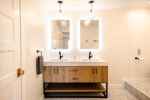 a bathroom with a sink and a mirror at The Cliffside Poustinia in Kodiak