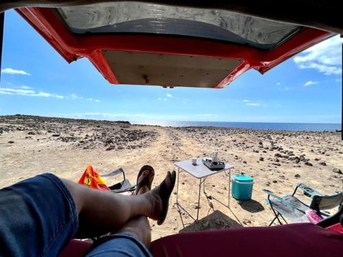 a person with their feet up on the beach at w DiscoveryCanarias II in San Miguel de Abona