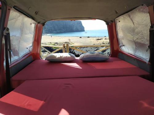 a seat in the back of a van with a beach at w DiscoveryCanarias II in San Miguel de Abona