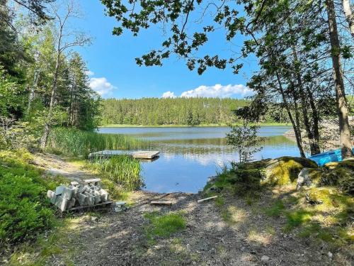 a view of a lake in the woods at 5 person holiday home in VALDEMARSVIK-By Traum in Valdemarsvik