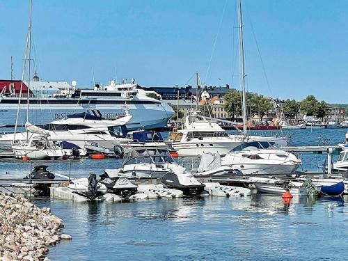 a bunch of boats are docked in a harbor at 5 person holiday home in VALDEMARSVIK-By Traum in Valdemarsvik