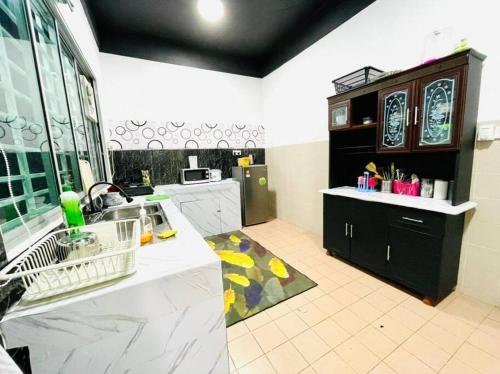 A kitchen or kitchenette at Double Storey terrace house in Sandakan Sabah