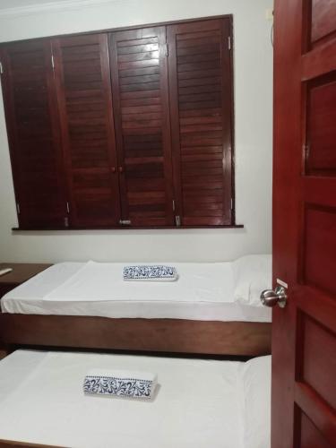 Postel nebo postele na pokoji v ubytování Mlajade Transient House