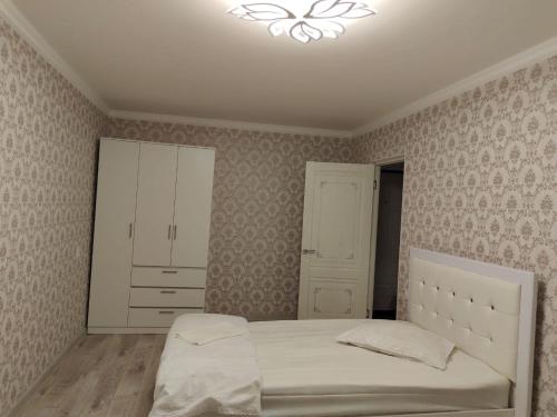 Krevet ili kreveti u jedinici u objektu Квартира в городе Хромтау