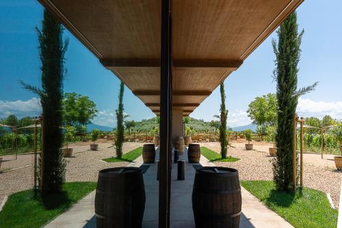 a view from the inside of a building with trees at Al Piglio Maison de Charme Wine & Wellness Resort in Piglio