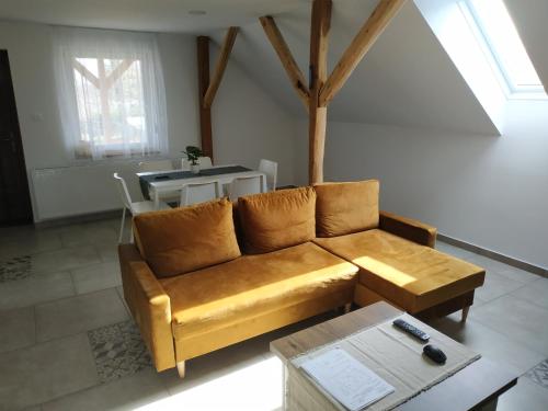 a living room with a couch and a table at BBFamily in Balatonboglár