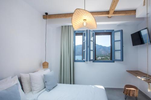 Ein Bett oder Betten in einem Zimmer der Unterkunft THALASSA