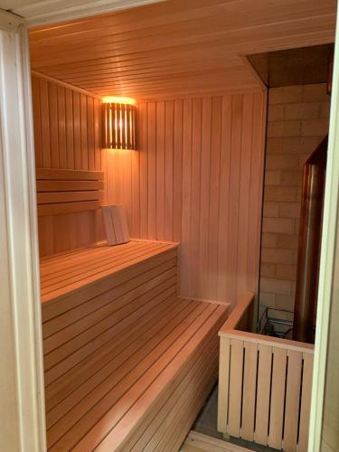 an empty sauna with a light on the inside at Hotel Konus in Făleşti