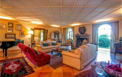 a living room with couches and a piano at Villa Santa Marina in Polistena
