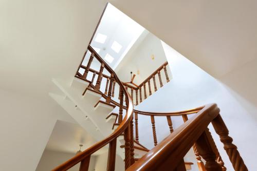 a spiral staircase with a glass ceiling at Yercaud Bungalow Stay in Yercaud