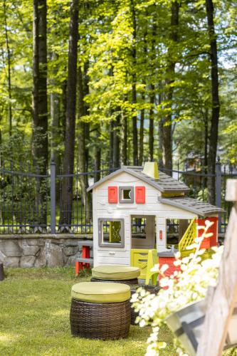 a toy house in the grass in a park at Willa Bór in Zakopane
