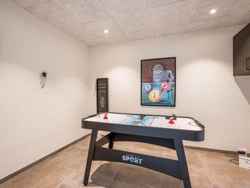 a ping pong table in the corner of a room at 6 person holiday home in Hvide Sande-By Traum in Hvide Sande
