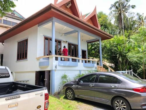 a house with a car parked in front of it at 1 bedroom Villa on Ao Yon beach with sea views in Phuket Town