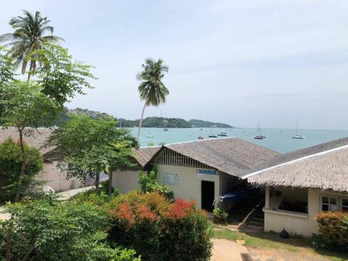 a house with a view of the water and boats at 1 bedroom Villa on Ao Yon beach with sea views in Phuket Town