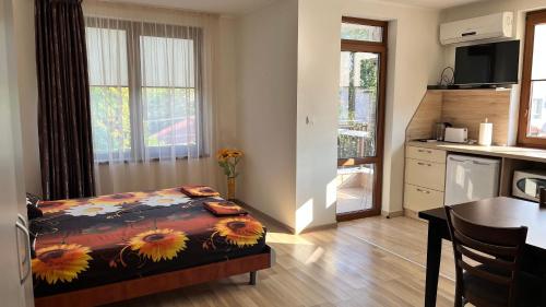 a bedroom with a bed with sunflowers on it at GUEST HOUSE ZORNICA in OBZOR in Obzor