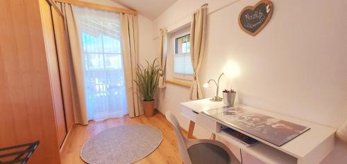 a room with a table and a table and a table and a window at Apartment Maier in Radstadt