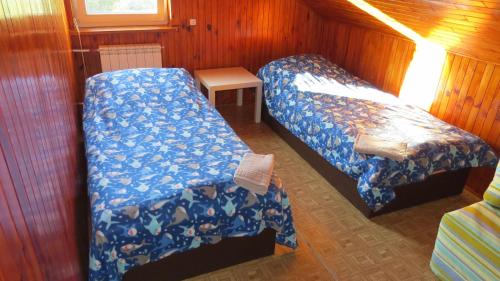 Una cama o camas en una habitación de BAŻANT SZCZEBRZESZYN