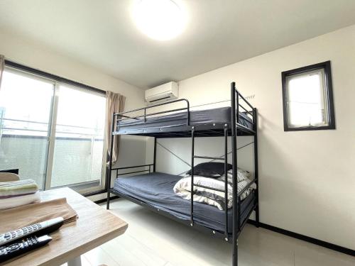 a bedroom with two bunk beds in a room at Credo Maison Kamakura - Vacation STAY 10395 in Kamakura