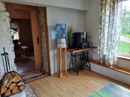 a room with a blue water heater next to a door at Hiiemäe Puhkemaja in Kunda