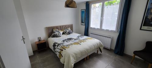 Llit o llits en una habitació de Les Geais Bleus