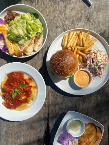 a group of plates of food on a table at Long Set Resort in Koh Rong Island