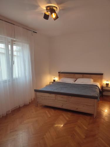 a bedroom with a bed and a ceiling fan at Povljana Maris in Povljana