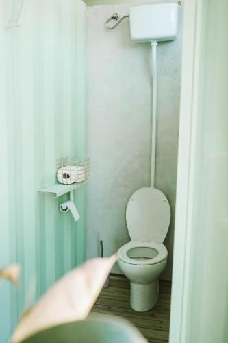 a small bathroom with a toilet in a room at Dreamsea Mediterranean Camp in Benitachell