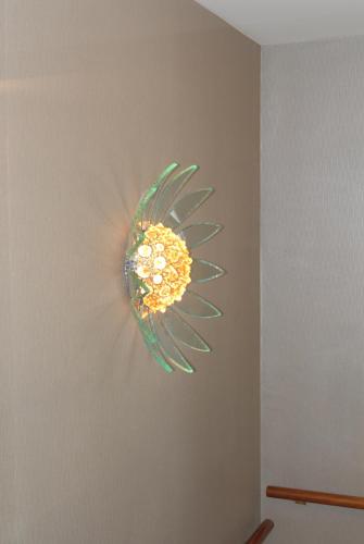 a painting of a flower on a wall at Hotel Sole in Giulianova