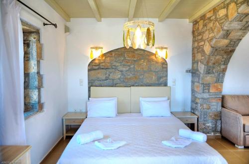 Katil atau katil-katil dalam bilik di Aquapetra Hotel