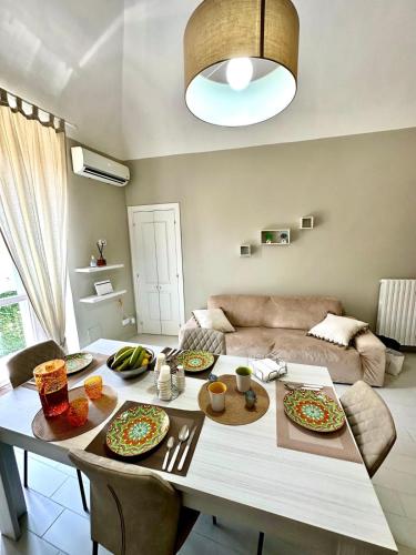 a living room with a table with plates of food at B&B La Reggia del Sol in Trani