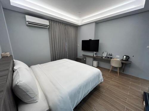 TV a/nebo společenská místnost v ubytování Yuyu Xiangyu BnB