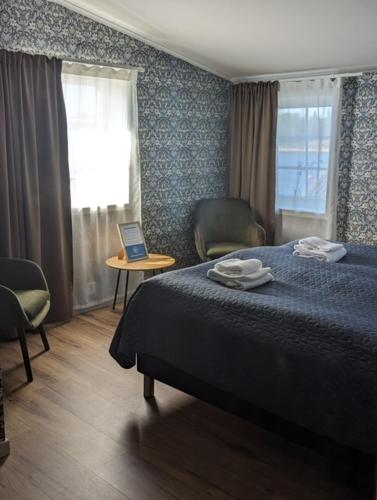 מיטה או מיטות בחדר ב-Ulvö Hamnkrog