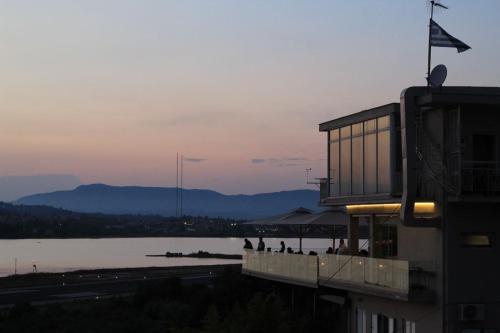 a building with a view of a body of water at Best View Stylish Penthouse in Corfu Town