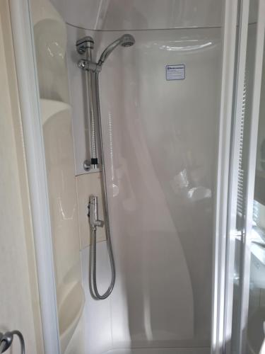 a shower in a bathroom with a glass door at Beautiful 3 bedroom holiday home Amazing views in Gisburn