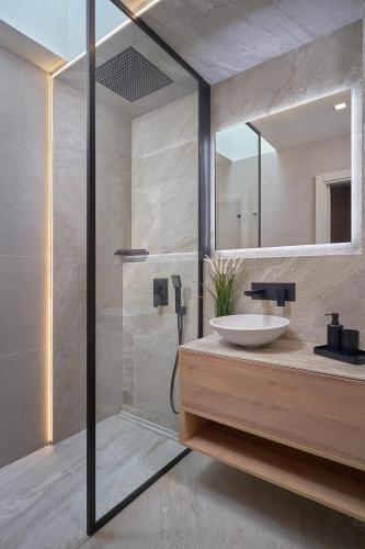 a bathroom with a sink and a shower at Salobre Oasis Suites in Salobre