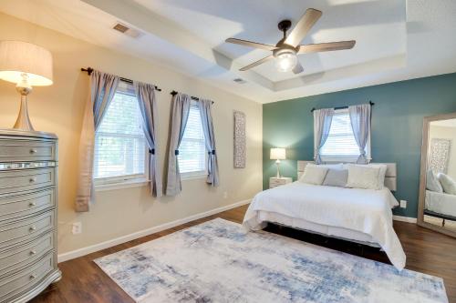 a bedroom with a bed and a ceiling fan at Southern Escape in Guyton Private Yard and Hot Tub! in Port Wentworth