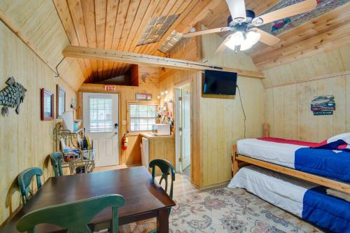 a bedroom with a bed and a table in a room at Emory Studio Cabin with Lake Fork Boat Access! in Emory