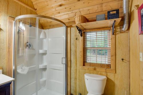 a bathroom with a toilet and a shower at Emory Studio Cabin with Lake Fork Boat Access! in Emory