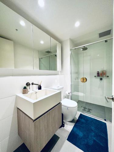 a bathroom with a sink and a toilet and a shower at "The Oak" in the heart of CBD in Adelaide
